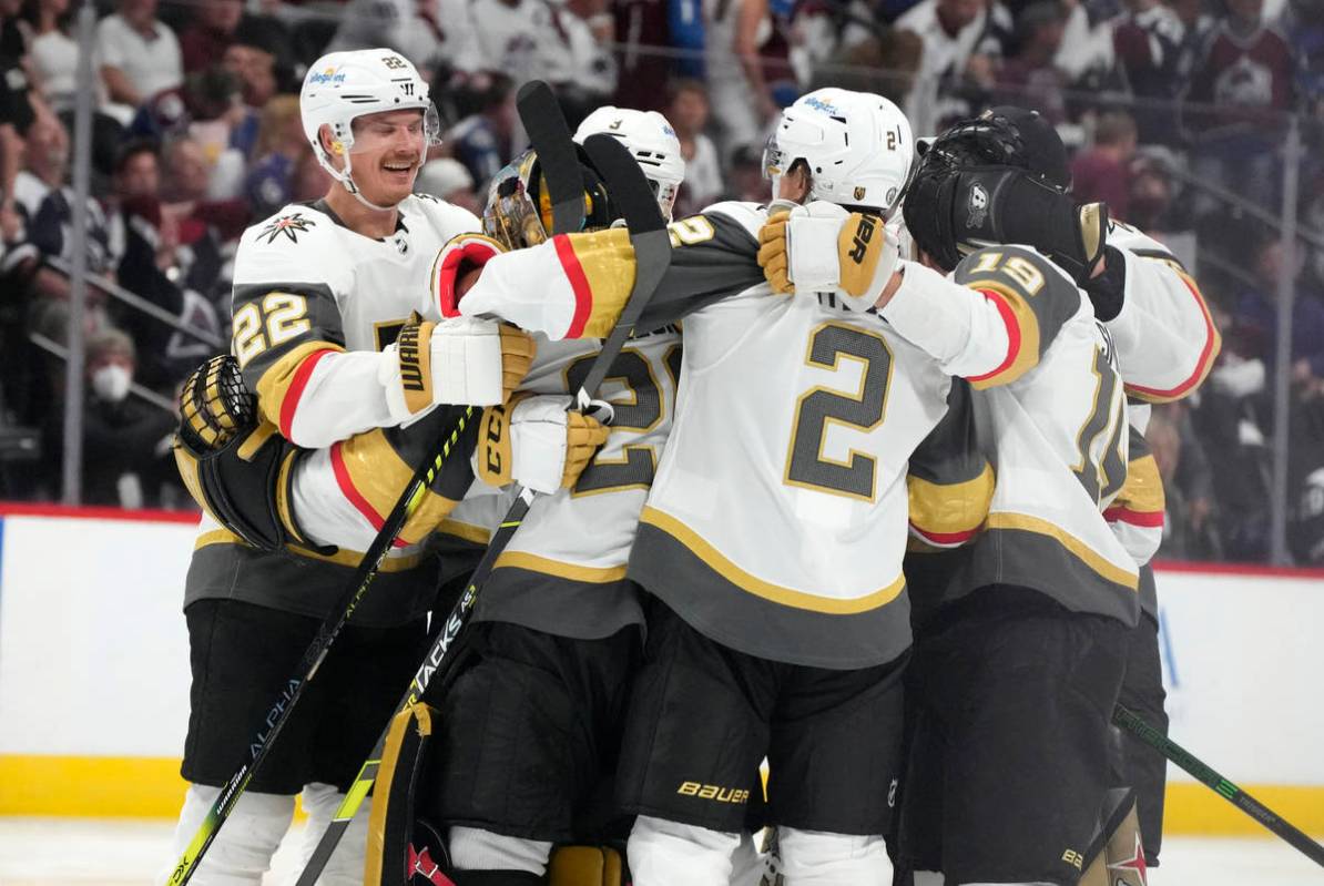 Vegas Golden Knights defenseman Nick Holden celebrates with goaltender Marc-Andre Fleury, defen ...