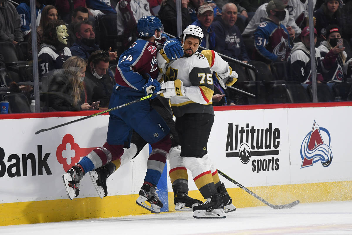 Colorado Avalanche defenseman Patrik Nemeth (24), left, hits Vegas Golden Knights right wing Ry ...