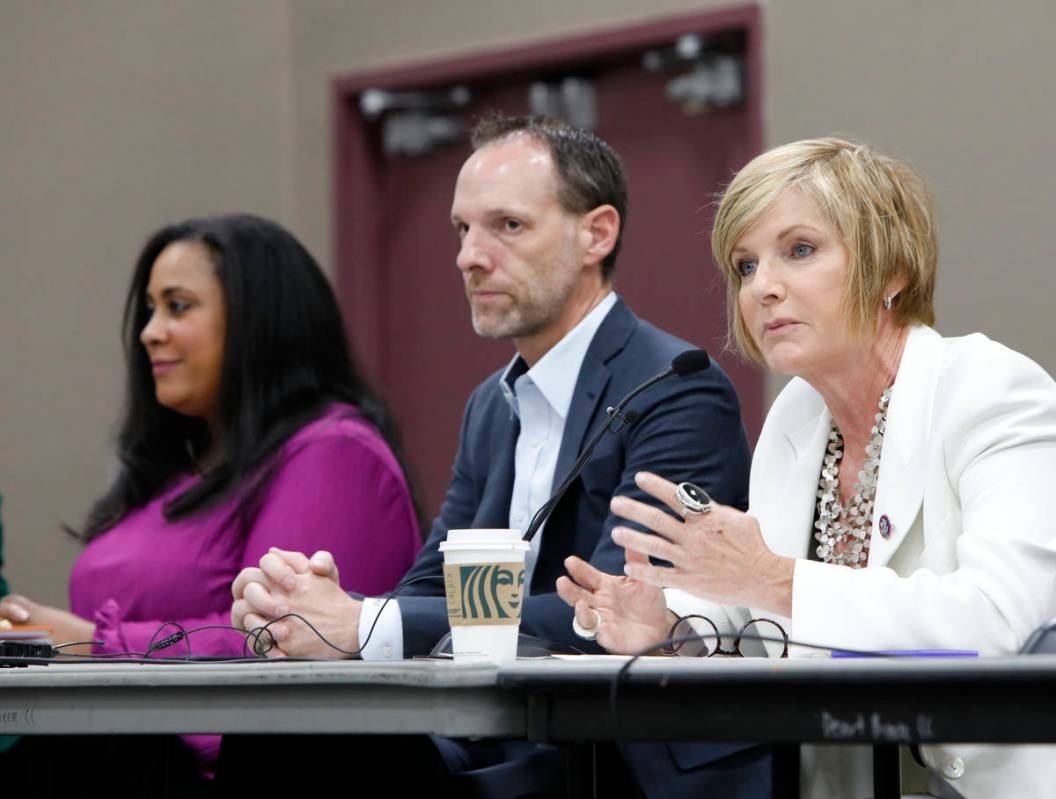 Rep. Susie Lee, D-Nev., right, speaks during a Housing Resource Talk at Desert Breeze Community ...