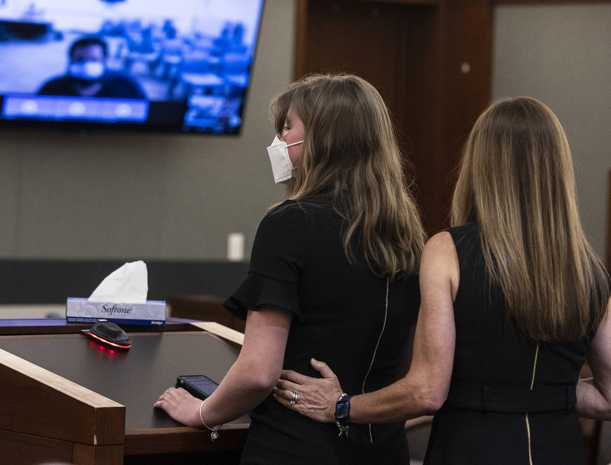 Angela Ahmet, right, comforts her daughter Jasmine, 17, as she delivers her victim impact state ...