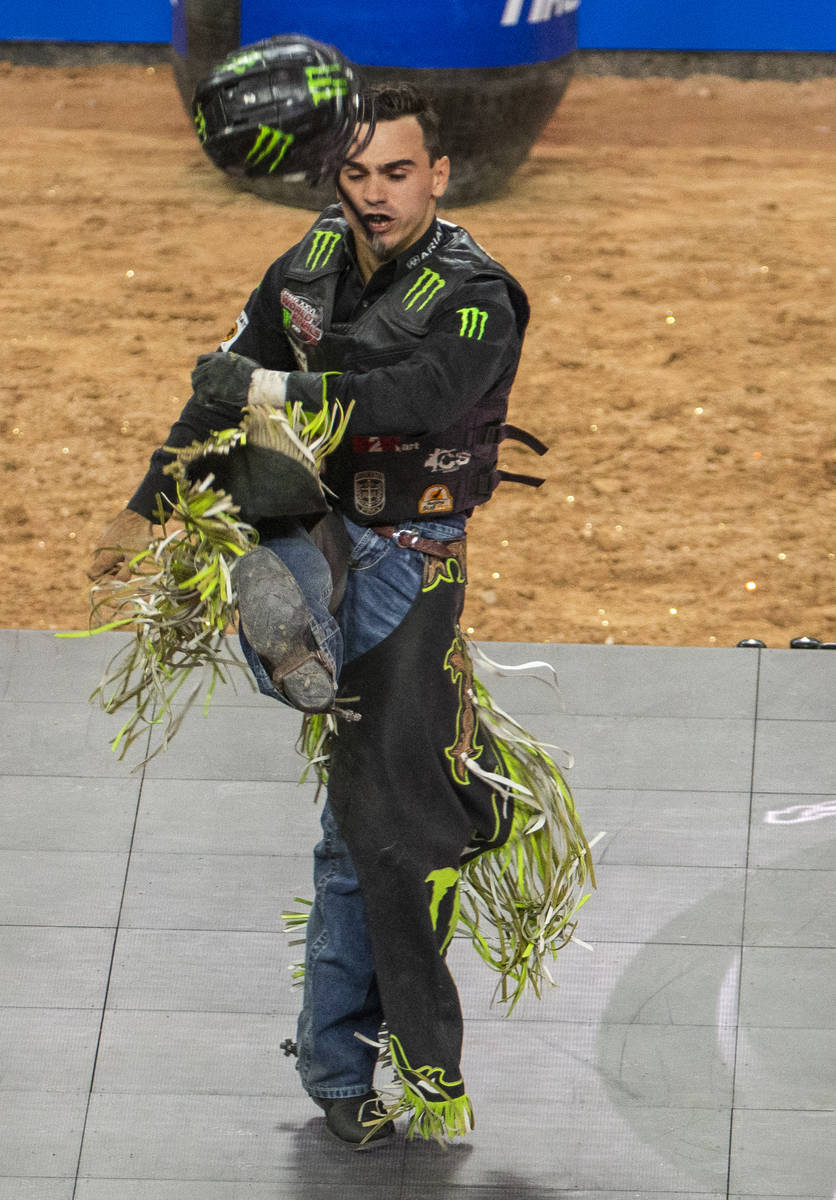 Jose Vitor Leme kicks his helmet after a successful ride atop of Cochise during the last day of ...