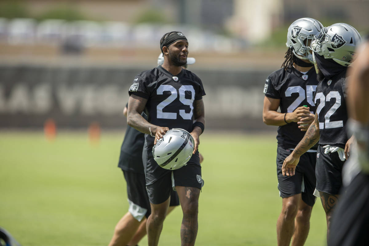 Raiders cornerback Casey Hayward Jr (29) speaks with cornerback Keisean Nixon (22) during their ...