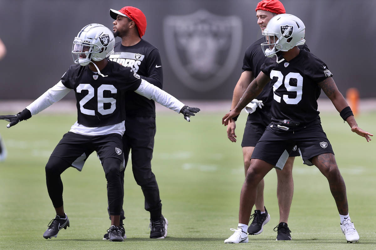 Las Vegas Raiders cornerback Nevin Lawson (26) and cornerback Casey Hayward Jr (29) runs a dril ...