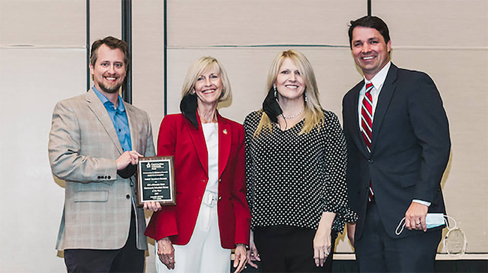 Communities in Schools of Southern Nevada Executive Director Cheri Ward, second from left, pres ...