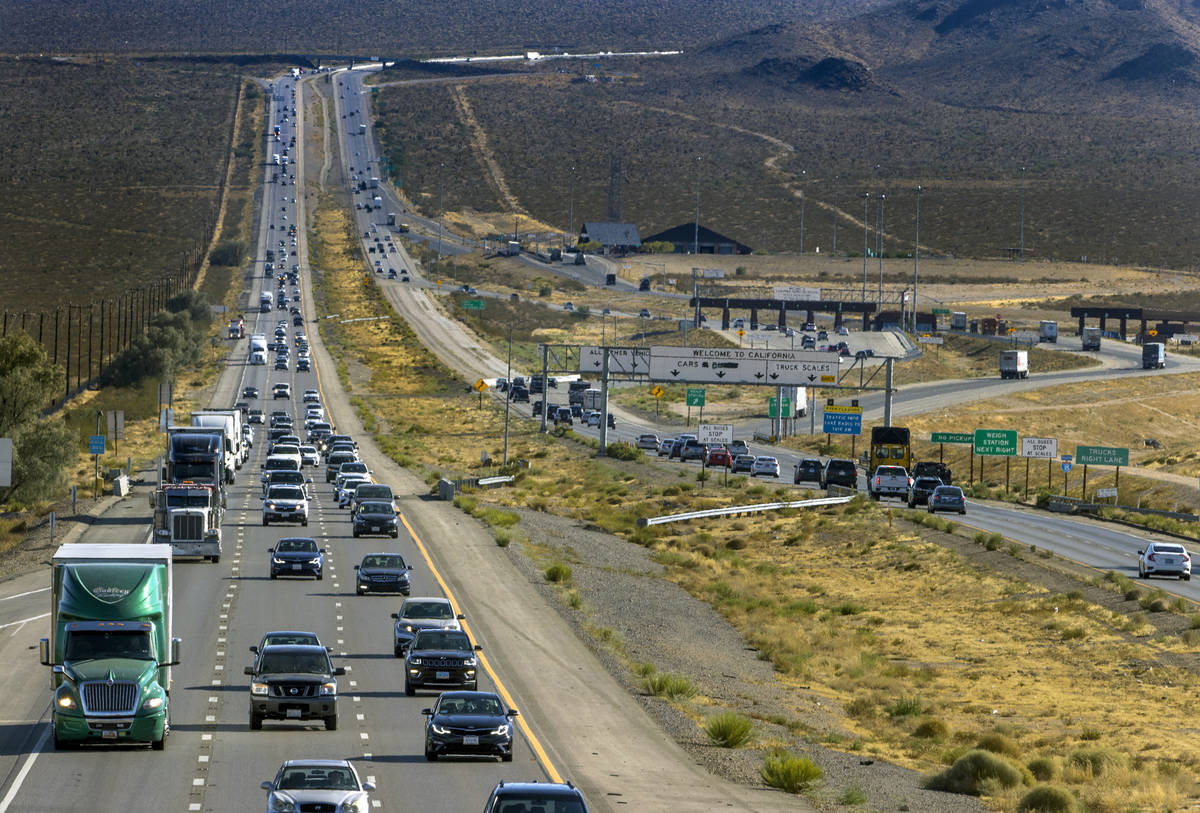 Holiday weekend traffic gets heavier at the state line as vehicles move northbound on Interstat ...