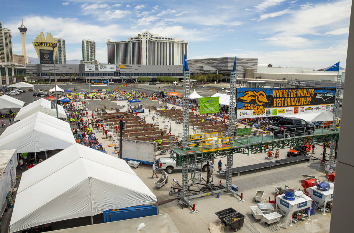 Competitors work their bricks and mortar in the Spec Mix Bricklayer 500 during World of Concret ...