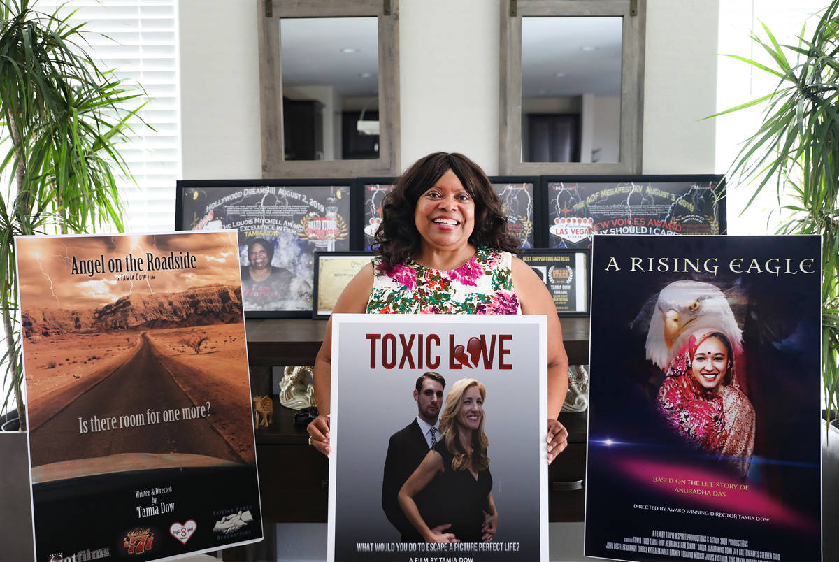 Tamia Dow is surrounded by posters and awards for her films at her friend's home in Las Vegas W ...