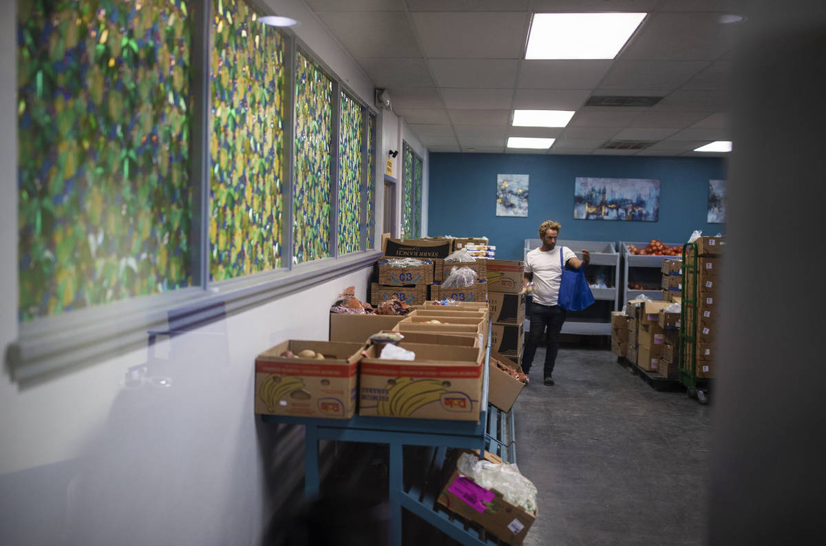 A client shops in the food bank at City Impact Center on Tuesday, June 8, 2021, in Las Vegas. ( ...
