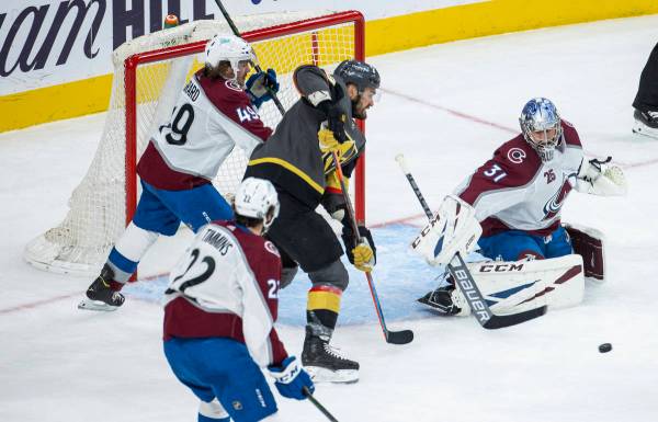 Golden Knights left wing William Carrier (28) readies to score over Colorado Avalanche goaltend ...