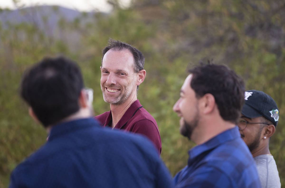 Clark County Commissioner Justin Jones, center, speaks with attendees during an event to discus ...