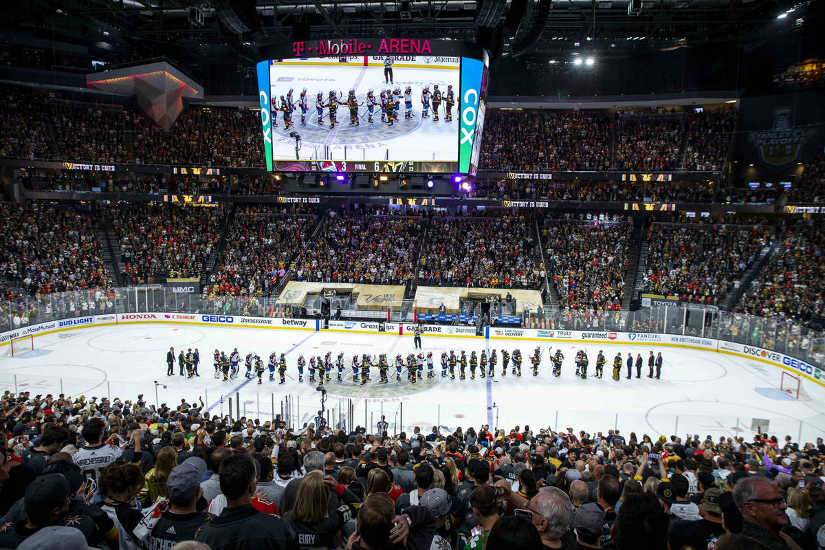 Players come together after the Golden Knights defeat the Colorado Avalanche 6-3 following the ...