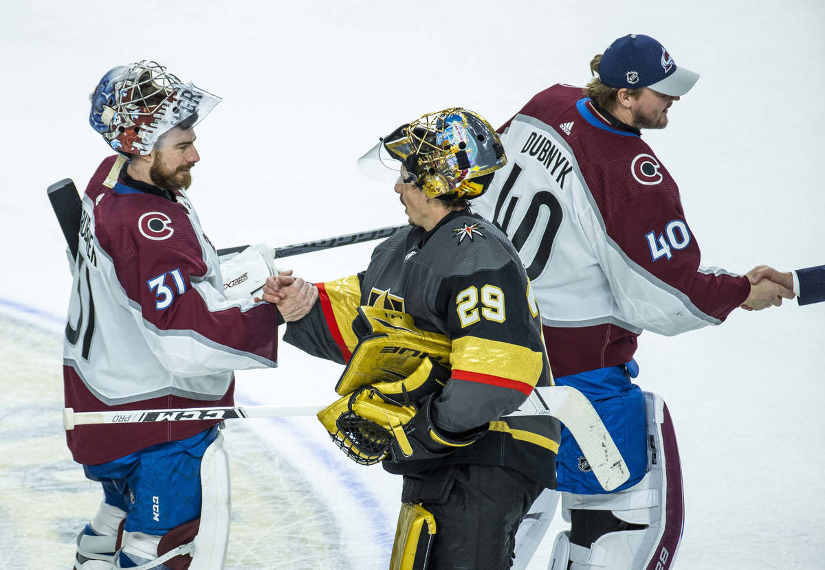 Golden Knights goaltender Marc-Andre Fleury (29) and Colorado Avalanche goaltender Philipp Grub ...