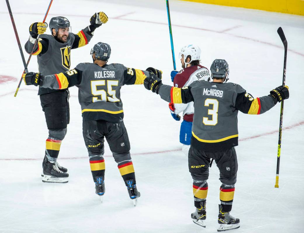 Golden Knights left wing William Carrier (28) celebrates his score with teammate right wing Kee ...