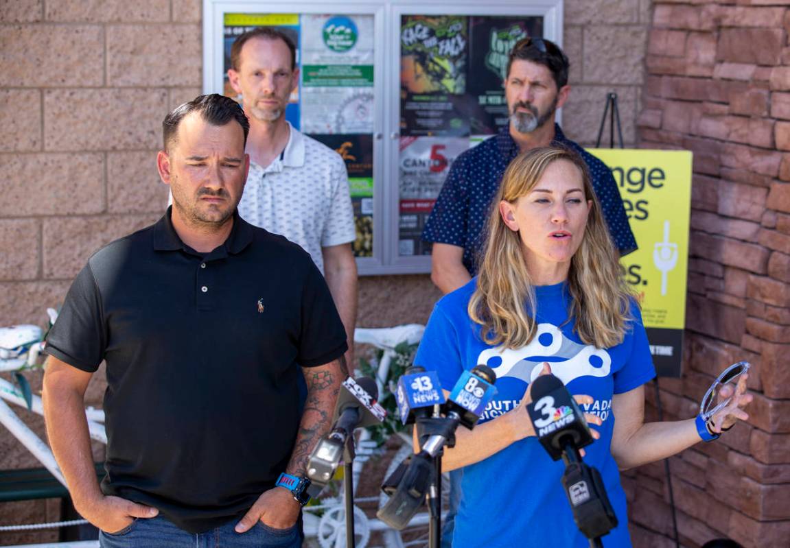 Rob Hutchinson, President of the Southern Nevada Bicycle Coalition, left, and Keely Brooks talk ...