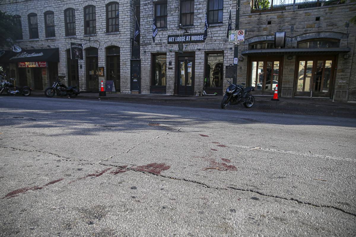 Blood stains remain on 6th Street after an early morning shooting on Saturday, June 12, 2021 in ...