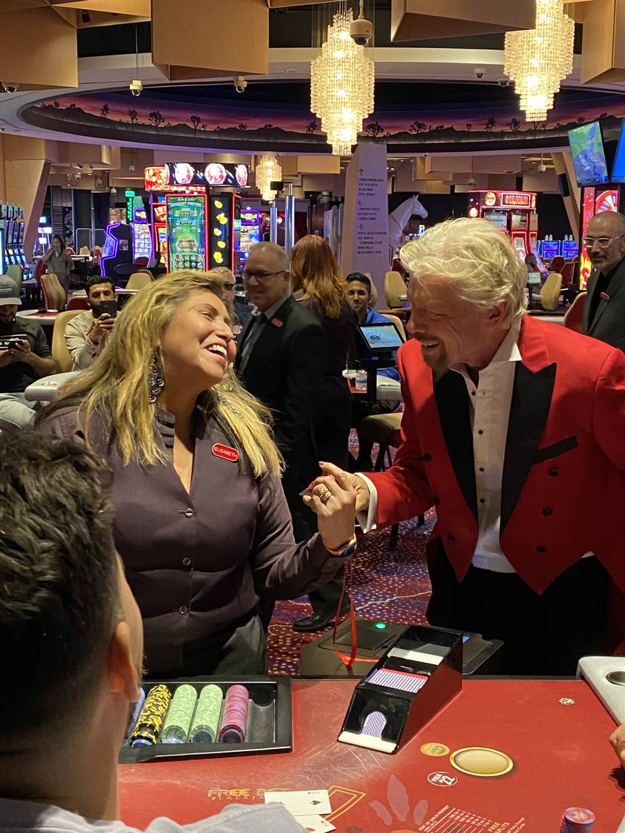 Virgin Group founder Richard Branson is shown with a blackjack dealer at Virgin Hotels Las Vega ...
