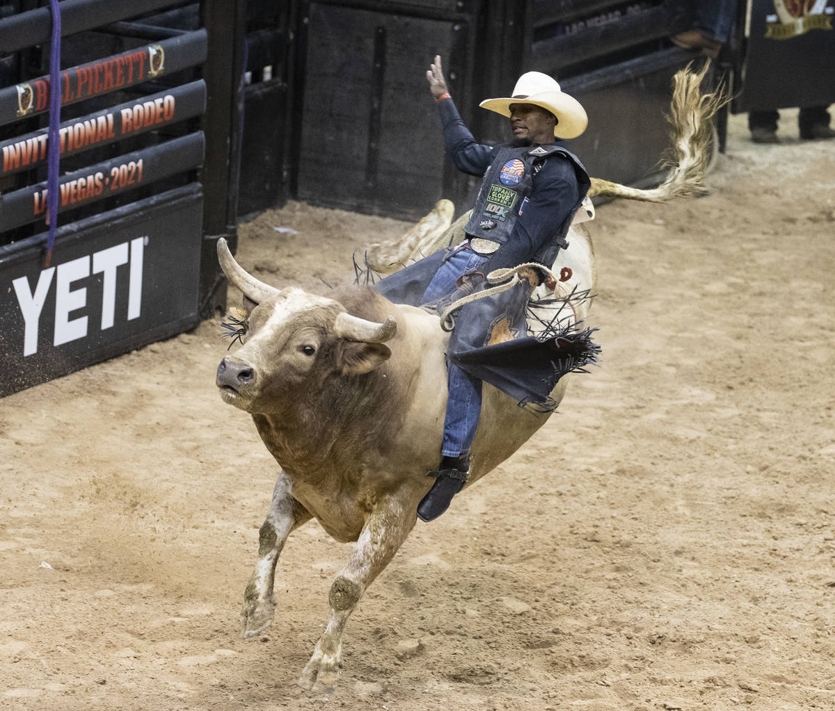 Winner of Bull Riding competition, Ouncie Mitchell, of Houston, Texas., rides Romeo while comp ...