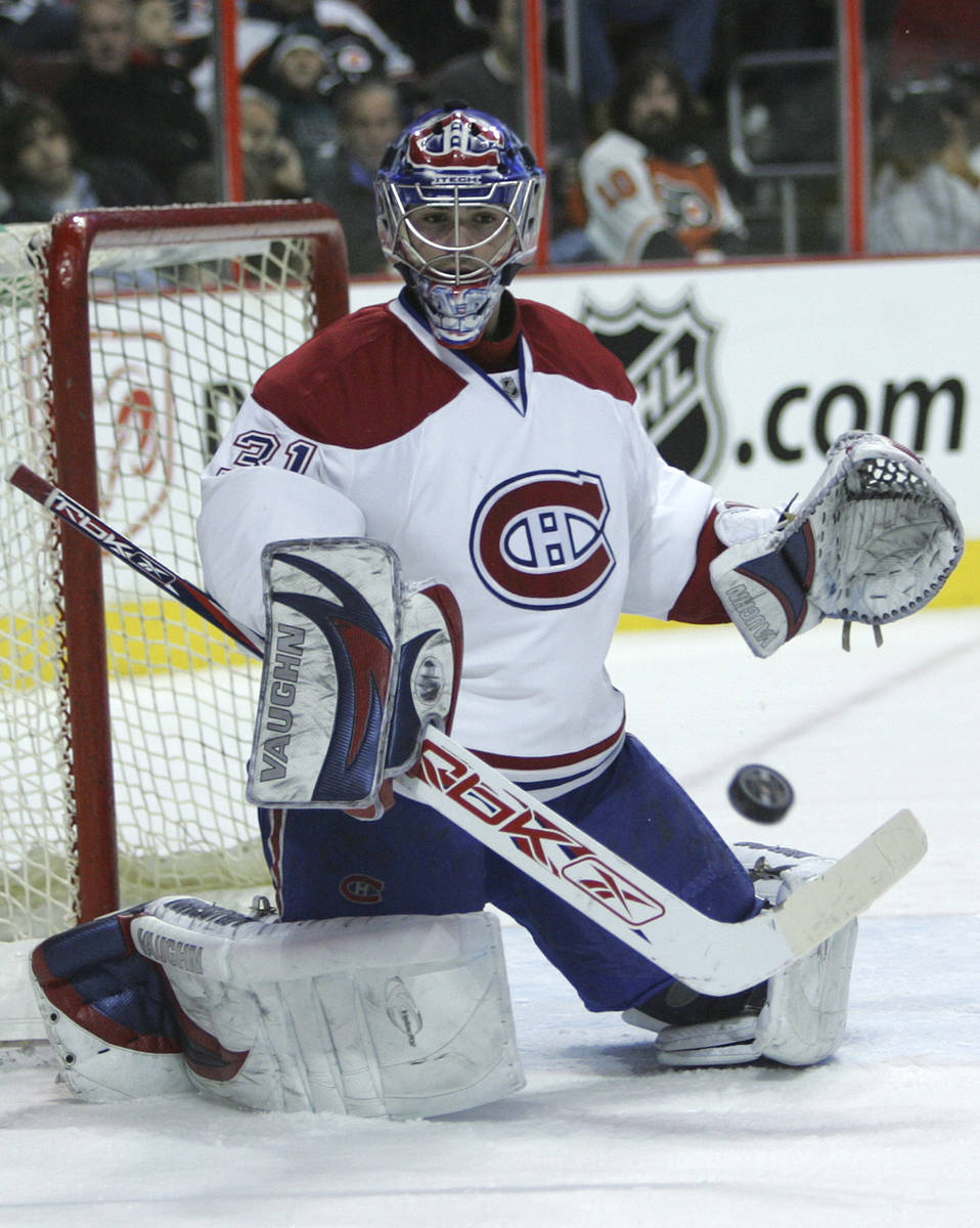 Montreal Canadiens' goalie Cary Price deflects the puck on a shot by the Philadelphia Flyers i ...