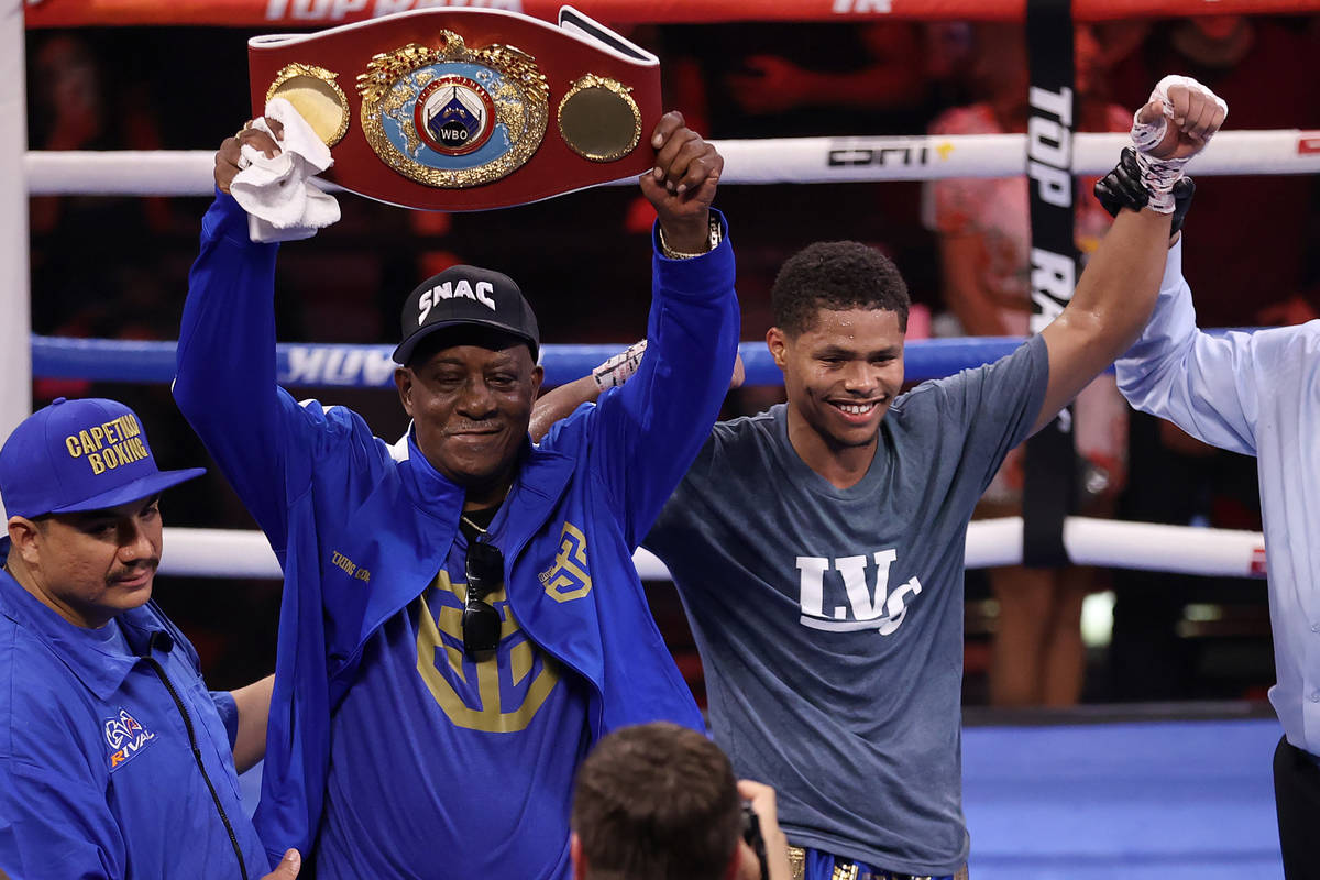 Shakur Stevenson, center, is announced the winner by unanimous decision against Jeremiah Nakath ...