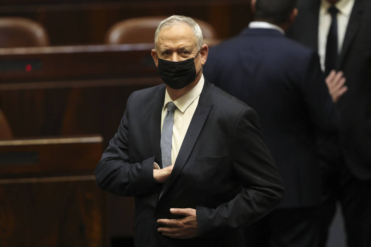 Israeli politician Benny Gantz stands during a Knesset session in Jerusalem Sunday, June 13, 20 ...