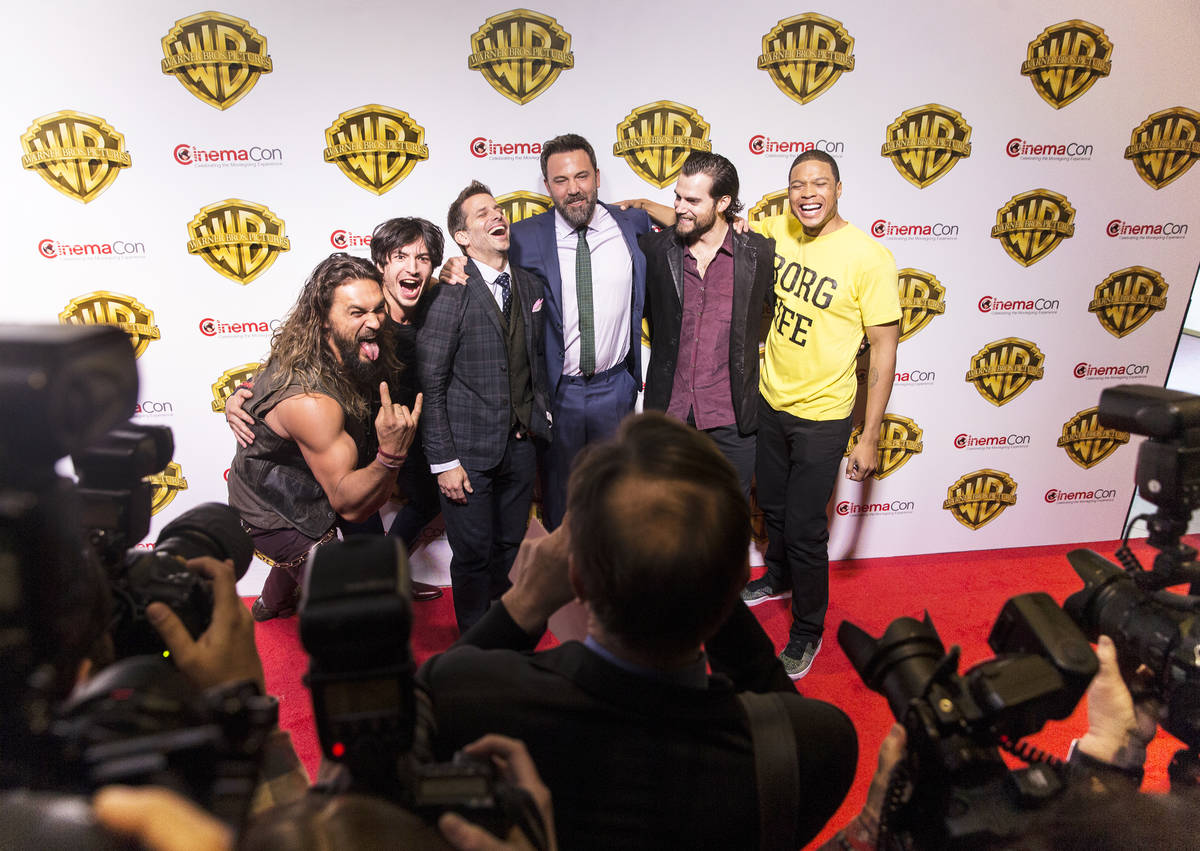 Jason Momoa, left, Ezra Miller, Zack Snyder, Ben Affleck, Henry Cavill and Ray Fisher joke arou ...