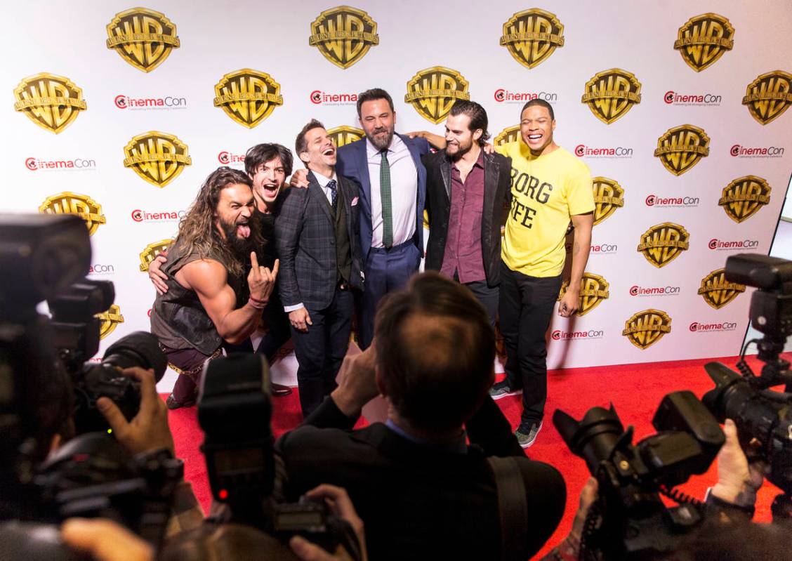 Jason Momoa, left, Ezra Miller, Zack Snyder, Ben Affleck, Henry Cavill and Ray Fisher joke arou ...