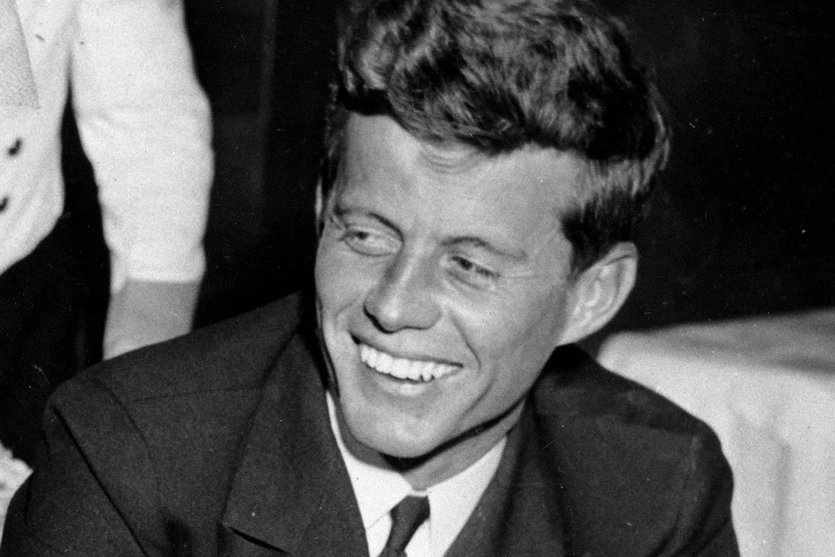 John F. Kennedy smiles at the Stork Club in New York. (AP Photo/File)