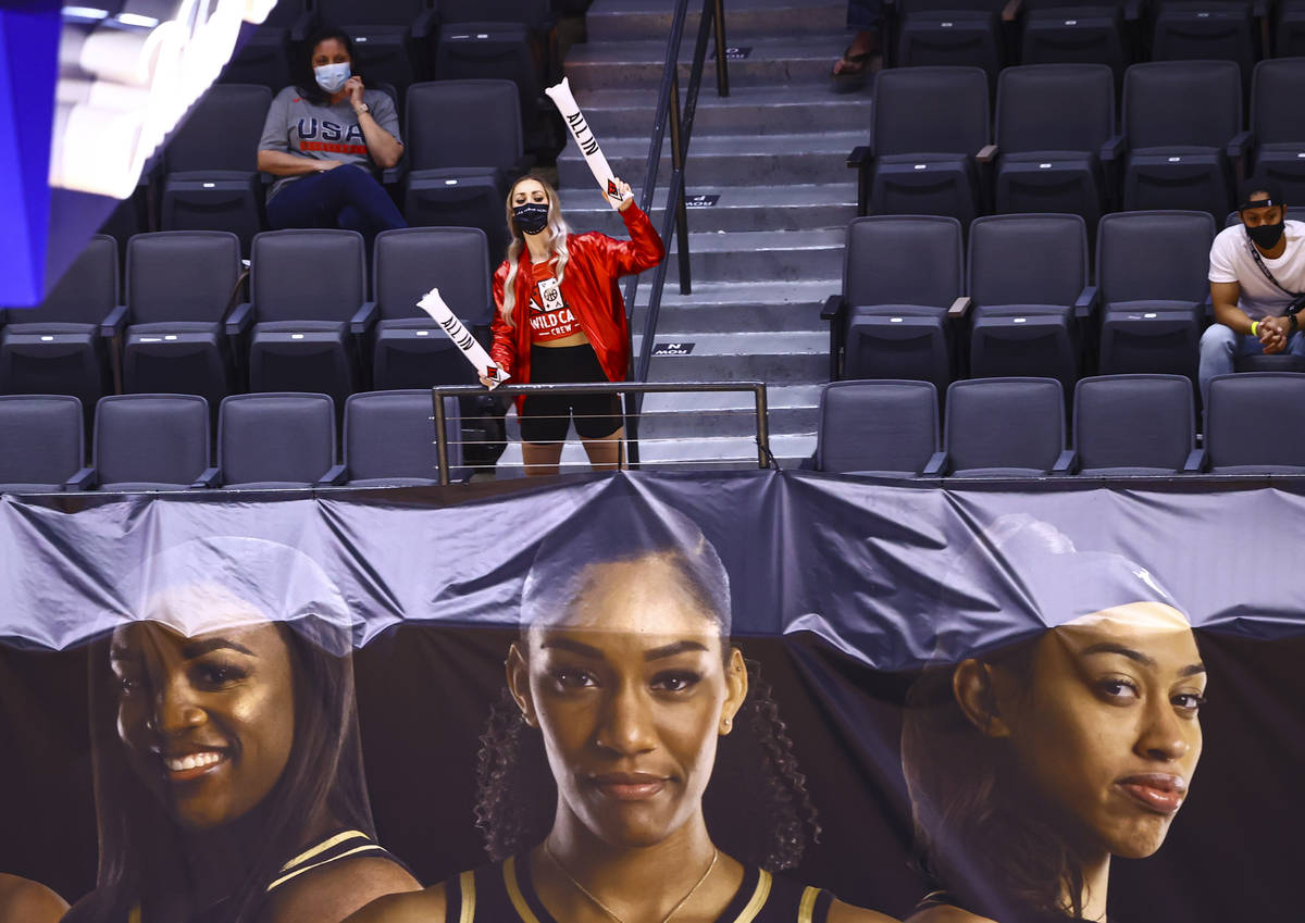 A member of the Las Vegas Aces Wild Card crew cheers during the second quarter of a WNBA basket ...
