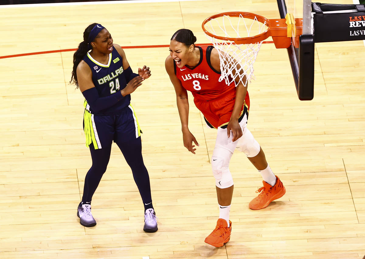 Las Vegas Aces' center Liz Cambage (8) reacts after scoring in front of Dallas Wings' guard Ari ...