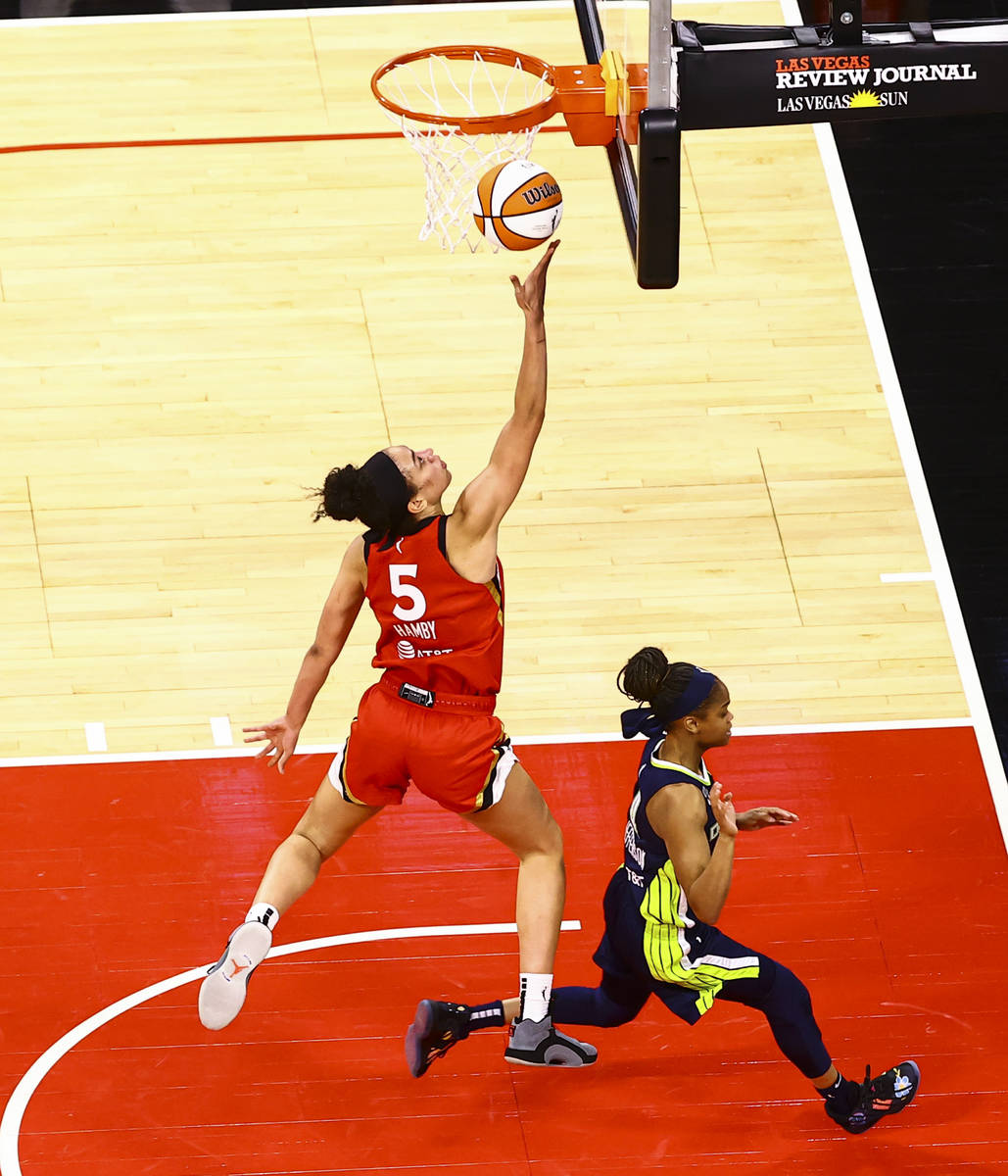 Las Vegas Aces' Dearica Hamby (5) shoots against Dallas Wings' Moriah Jefferson during the four ...