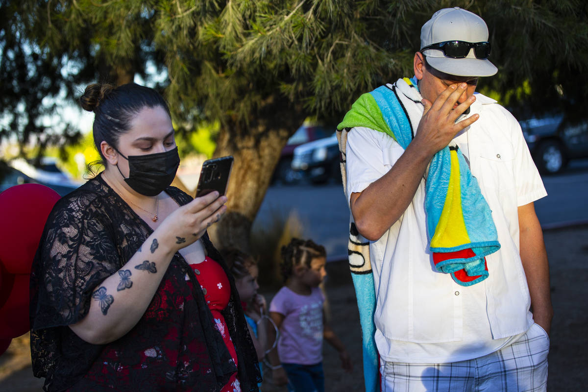 Vanessa Browning, left, reads a statement alongside Nicholas Husted, of San Jose, California, w ...