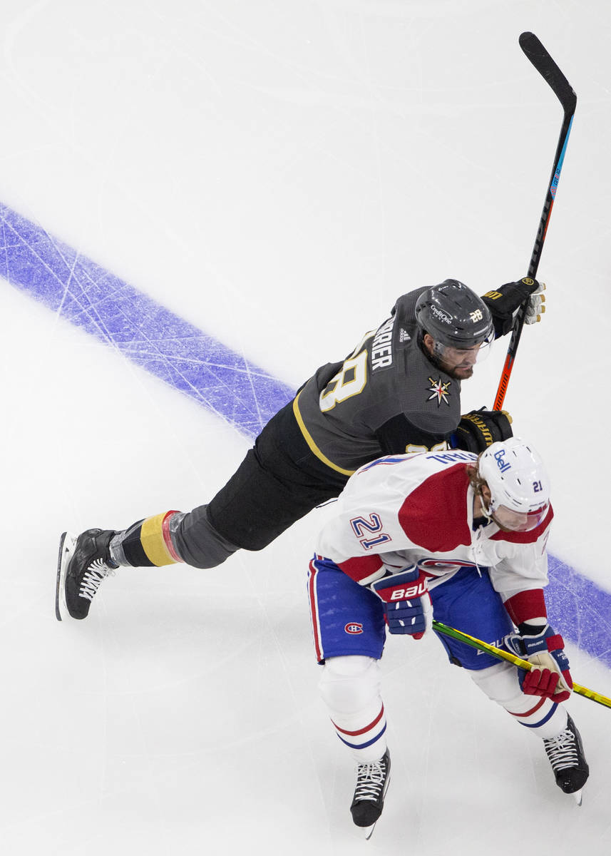 Golden Knights left wing William Carrier (28) skates around Canadiens center Eric Staal (21) du ...