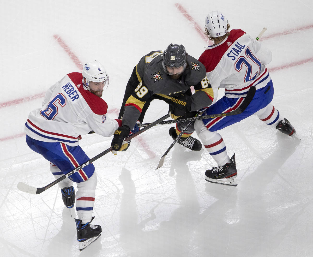 Canadiens defenseman Shea Weber (6) and center Eric Staal (21) block Golden Knights right wing ...
