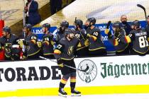 Golden Knights’ Shea Theodore (27) celebrates after scoring against the Montreal Canadie ...
