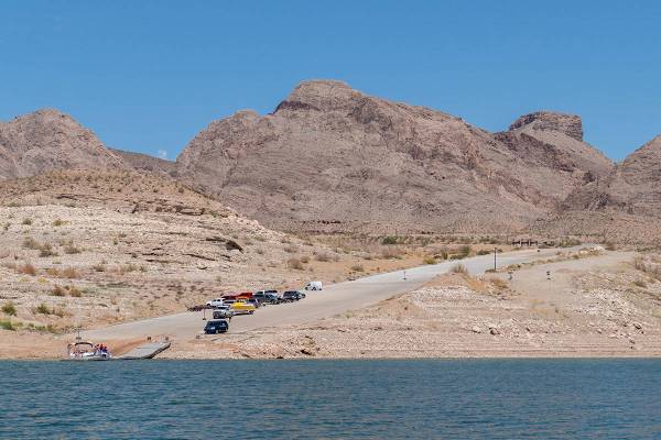 Vehicles line up on the South Cove boat launch ramp at the eastern end of Lake Mead in this pho ...