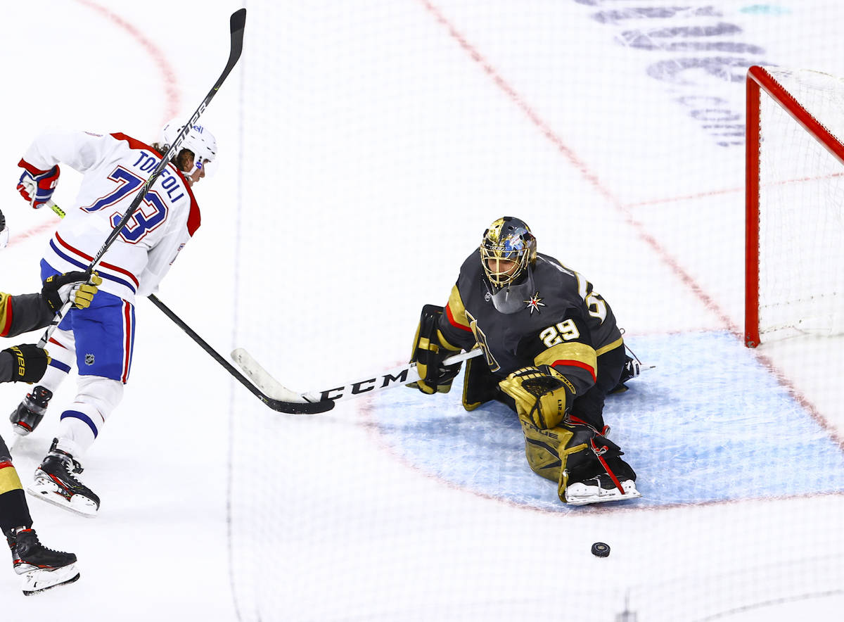 Golden Knights goaltender Marc-Andre Fleury (29) blocks the puck in front of Montreal Canadiens ...