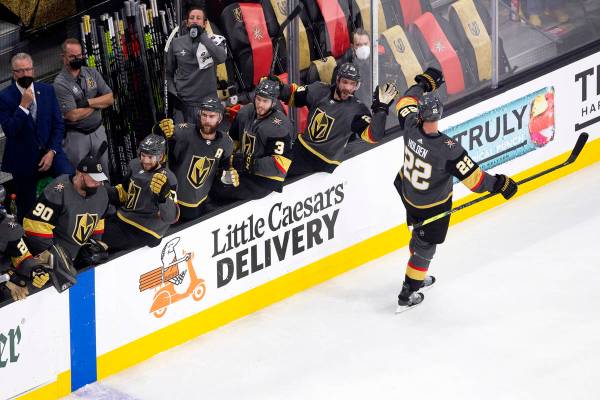 Golden Knights defenseman Nick Holden (22) is congratulated by his teammates after scoring a go ...