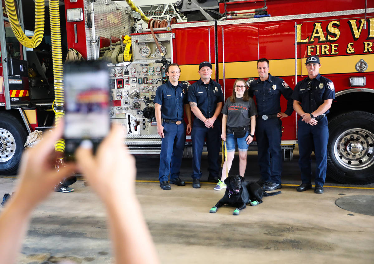 Firefighter Blake Mickelson, from left, firefighter Brian White, Faith Nault, Fire Station 1A C ...