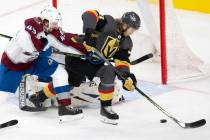 Golden Knights center William Karlsson (71) is about to score a goal on Avalanche goaltender Ph ...
