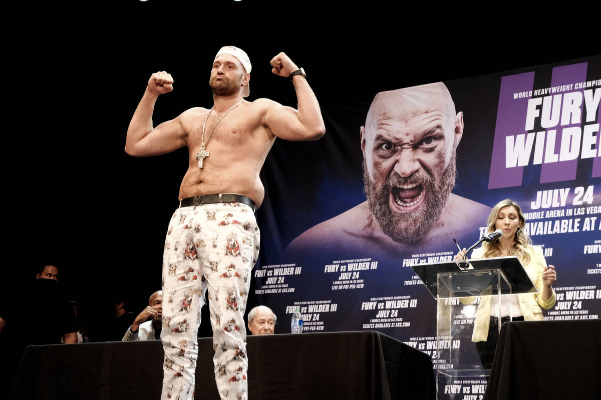 Tyson Fury poses during a news conference with Deontay Wilder in Los Angeles on Tuesday, June 1 ...