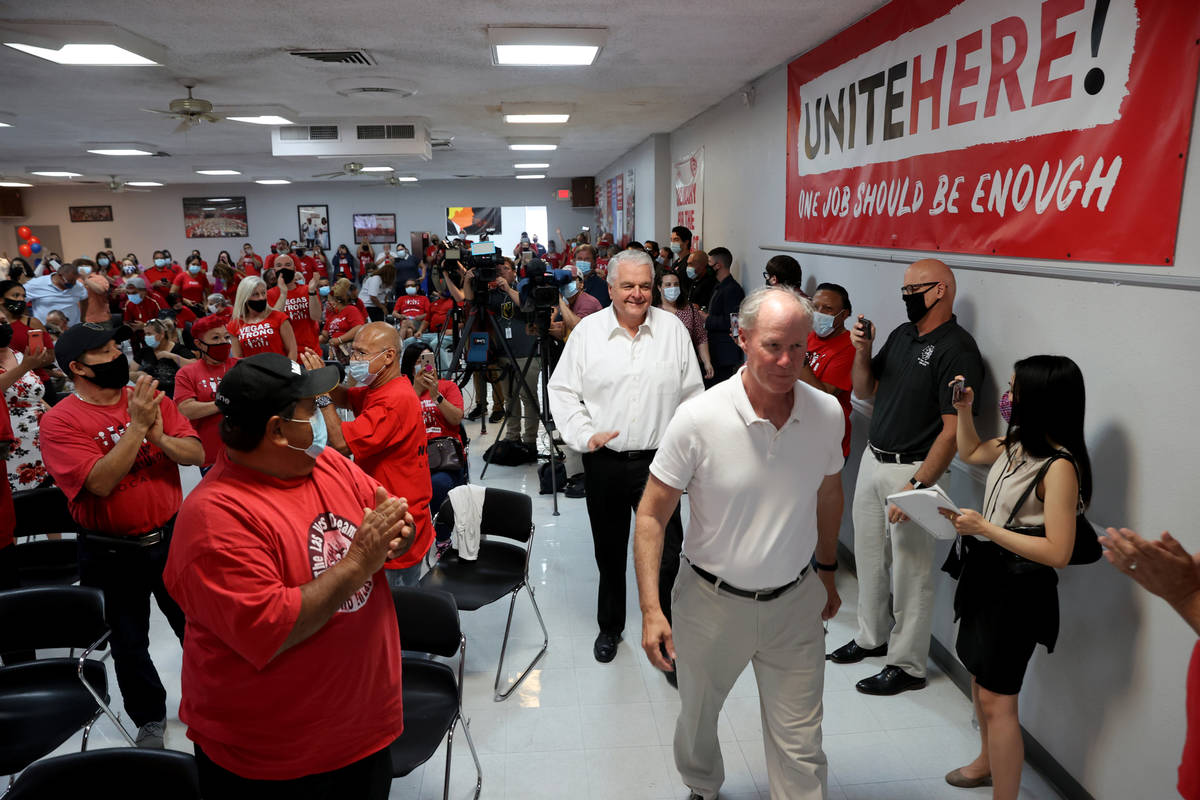 D. Taylor, president of the Culinary's parent union, UNITE HERE, right and Gov. Steve Sisolak a ...