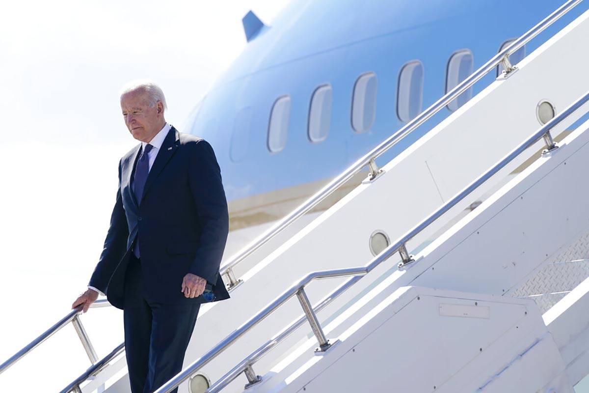 President Joe Biden steps off Air Force One at Geneva Airport in Geneva, Switzerland, Tuesday, ...