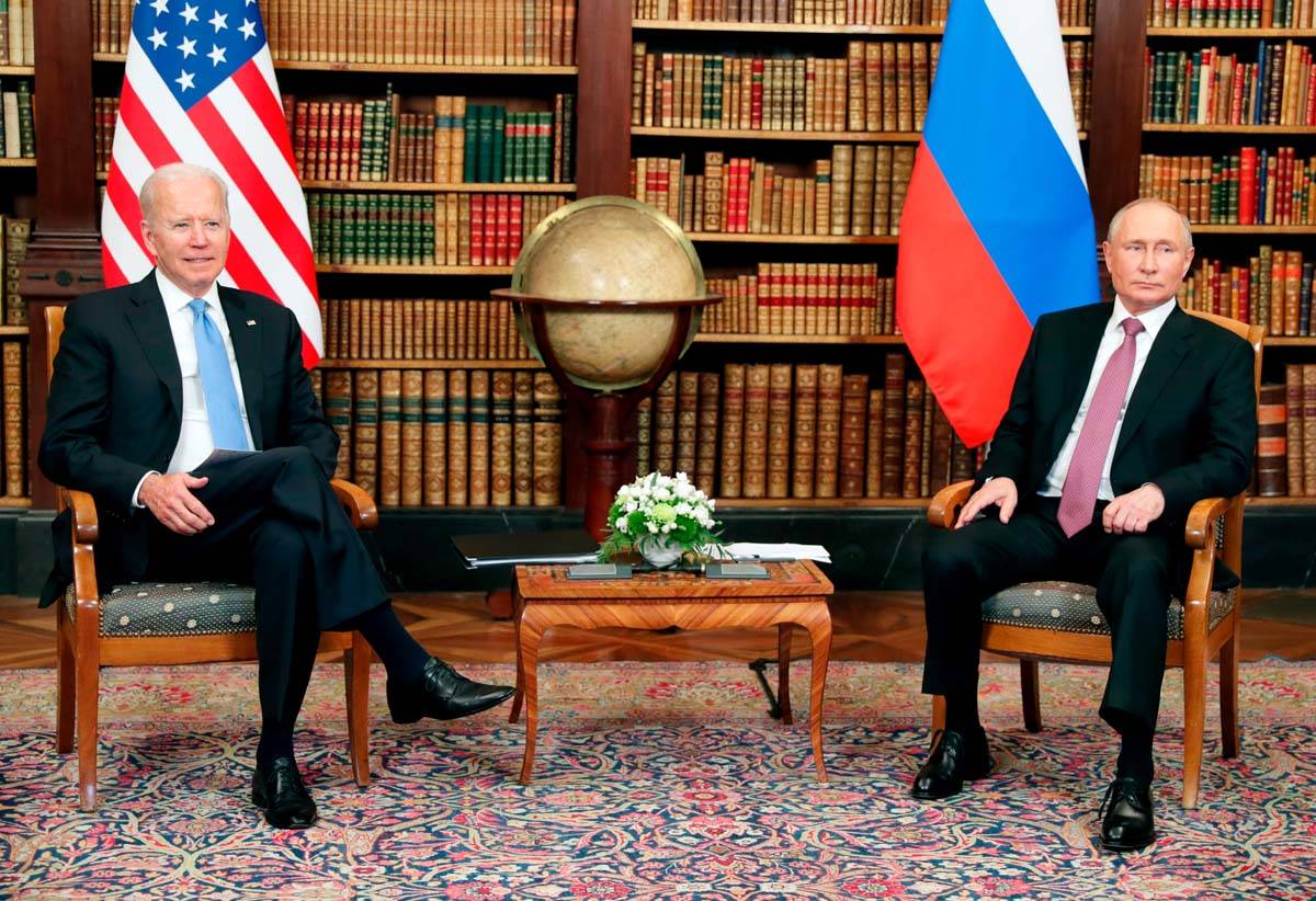 U.S President Joe Biden, left, and Russian President Vladimir Putin pose for media during their ...