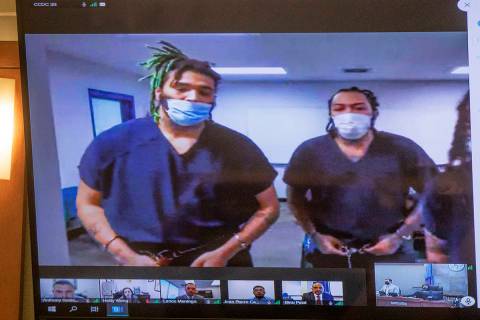 Dasean Williams, from left, and Marcus Parker, right, appear in court virtually for a hearing a ...