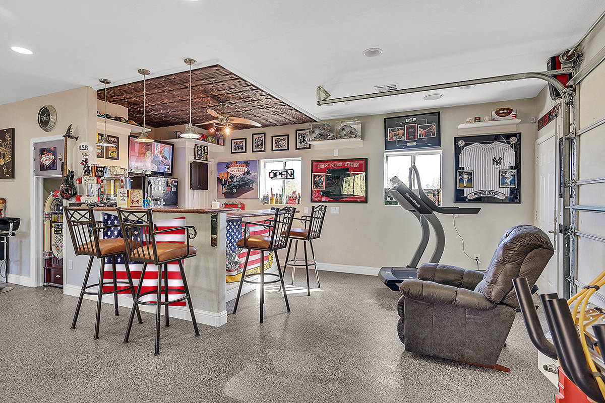 Allen Foster created his own showcase garage with custom paint, epoxy flooring, security shutte ...