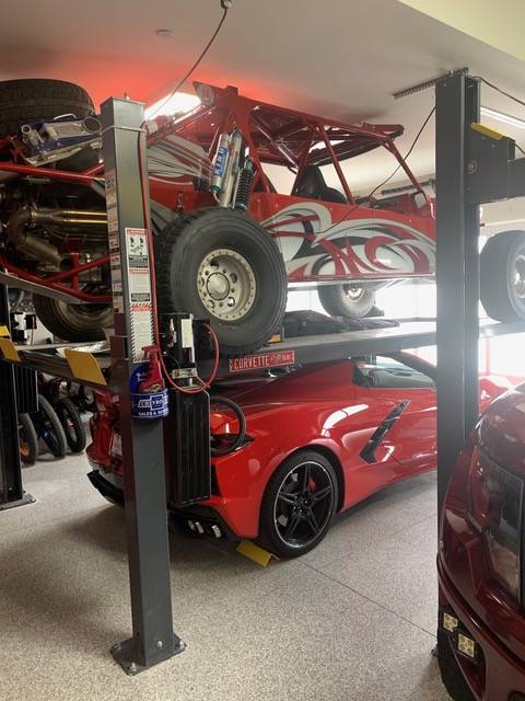 Mike Bilek approaches the lack of garage space by storing his collection on hydraulic lifts, do ...