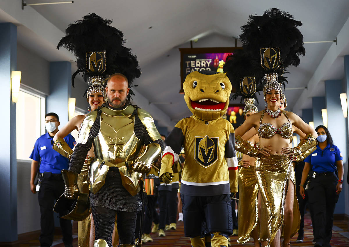 Golden Knights mascot Chance and the Golden Knight help lead a parade before the start of Game ...