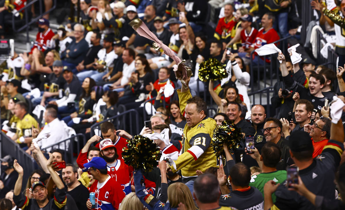 Cameron Hughes performs to hype up the crowd during the first period of Game 2 in an NHL hockey ...