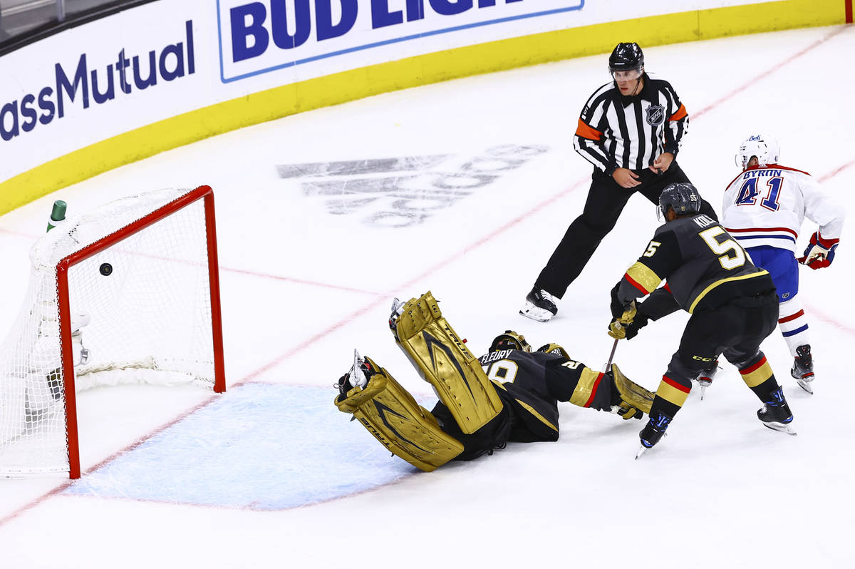 Montreal Canadiens' Paul Byron (41) scores a goal past Golden Knights goaltender Marc-Andre Fle ...