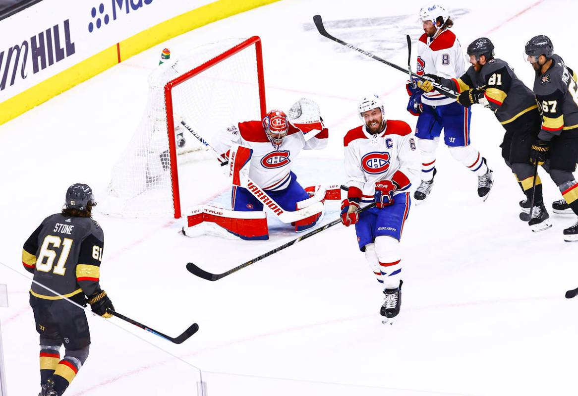 Montreal Canadiens' Shea Weber (6) blocks the puck in front of goaltender Carey Price (31) duri ...